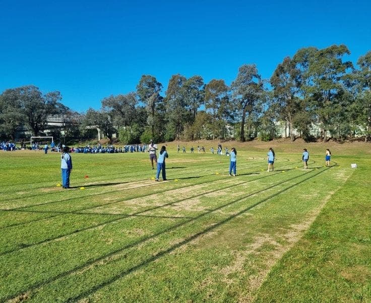 Students lined up on a running track to begin 200m race