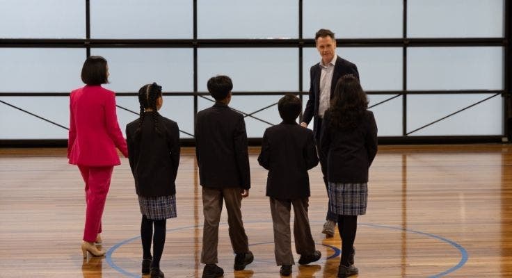 School captains walking with premier and education minister