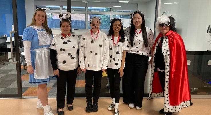 Teachers dressed as Dalmatians, Cruella De Vill and Alice in Wonderland for Book Week